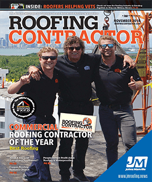 Three men in black shirts and sunglasses stand arm in arm atop a roof, smiling, on the cover of Roofing Contractor magazine’s November 2018 issue.